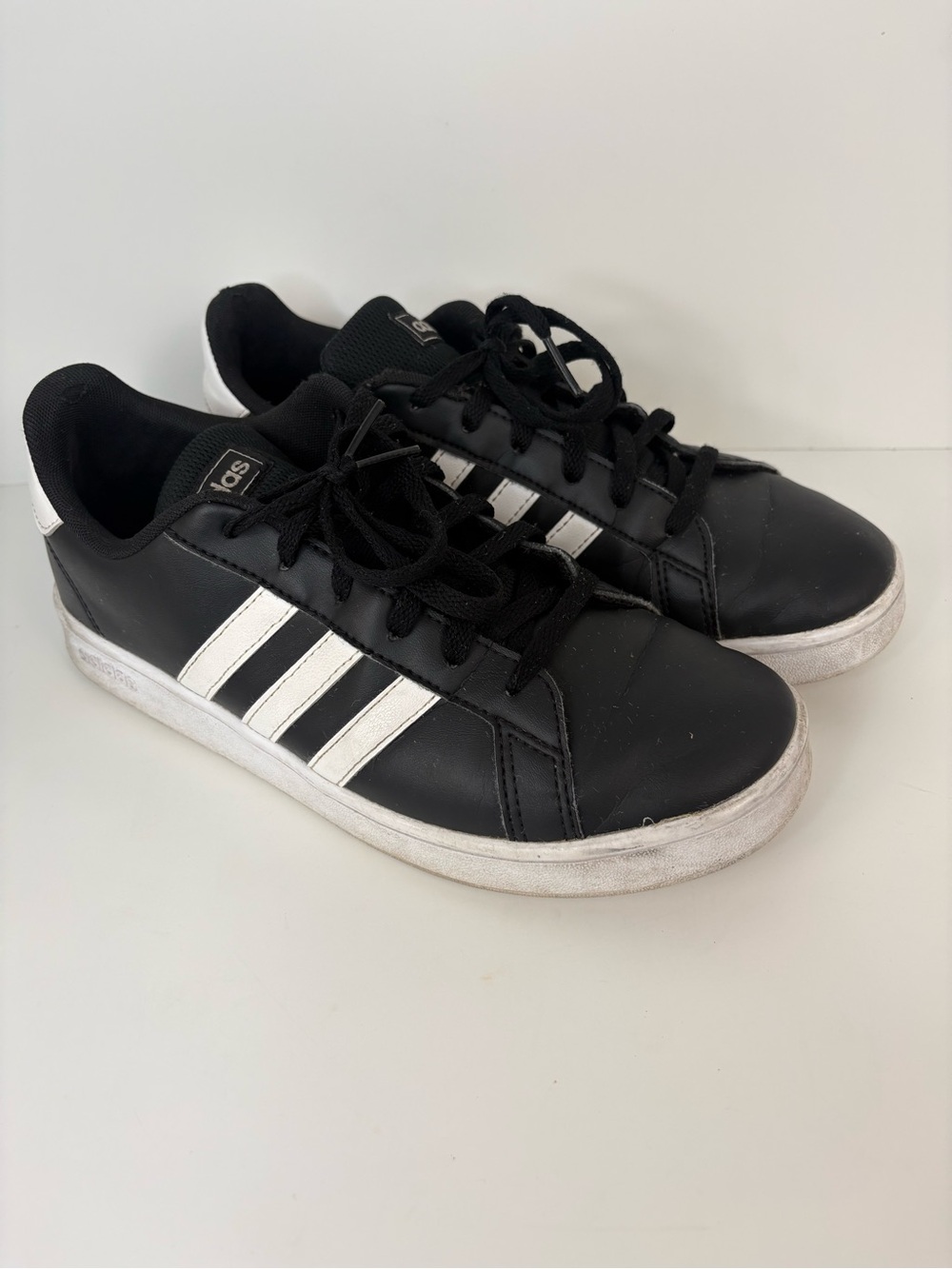 Black Sneakers with White Stripes